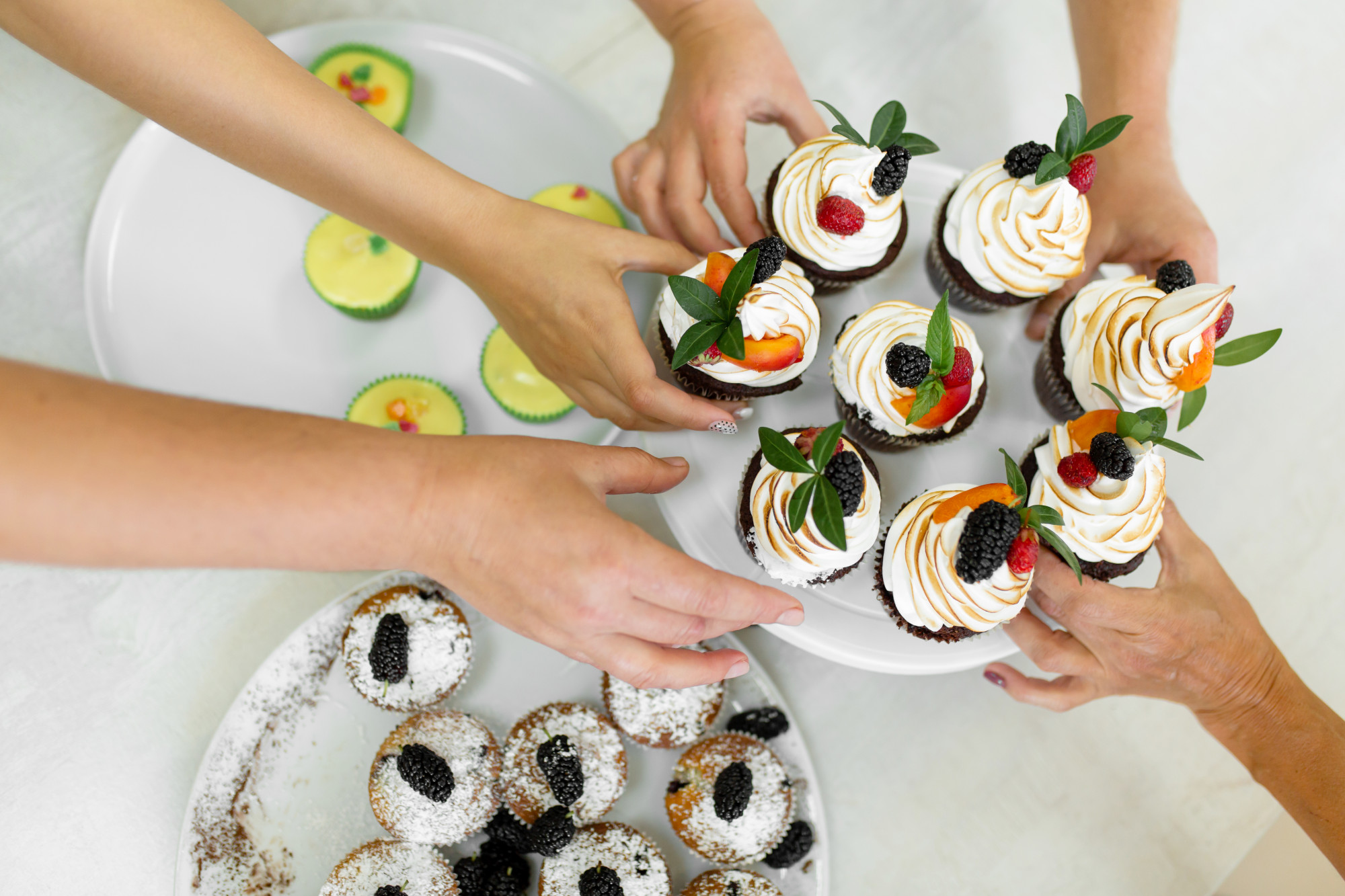 Students plating dessert in workshop